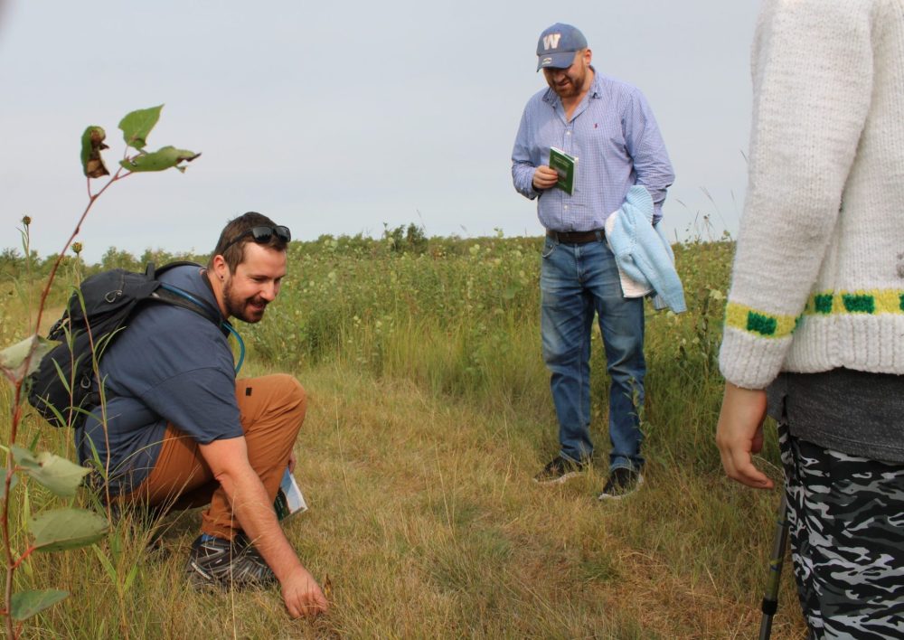 GREG VANDERMEULEN THE CARILLON
Norm Gregoire points out a long-dead example of a Western Prairie Fringed Orchid, a species at risk.