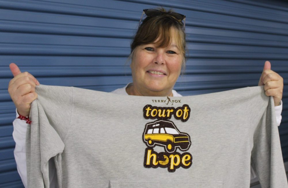GREG VANDERMEULEN THE CARILLON
Gina Davis holds up one of the many shirts she's saved from past Terry Fox Runs, this one from the early '80s.
