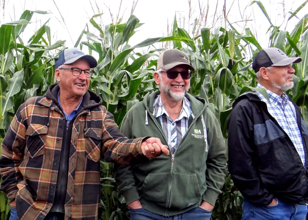 WES KEATING THE CARILLON
Eric Peters, Wendell Penner and Loren Warkentin in a tall stand of corn at the annual Marc Hutlet Seeds crop tour.