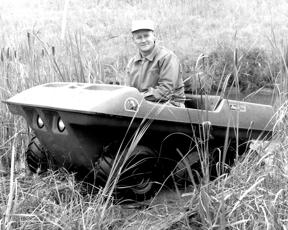 Alphonse Fournier demonstrates the versatility of the Amphicat as he maneuvers the machine through a marsh in the La Broquerie area. (Carillon Archives)