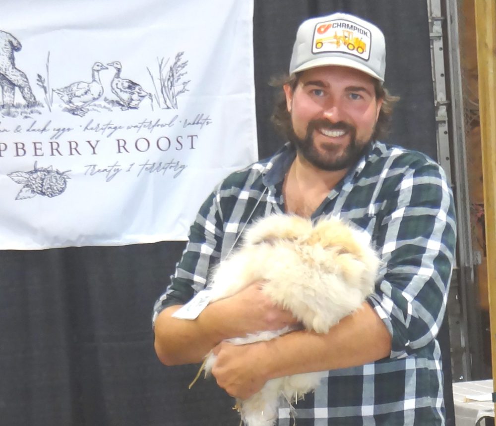 WES KEATING THE CARILLON
Andre Laframboise shows visitors “Nora”, an angora rabbit at the Raspberry Roost display in the Red River Ex barn during the Fibre Festival.