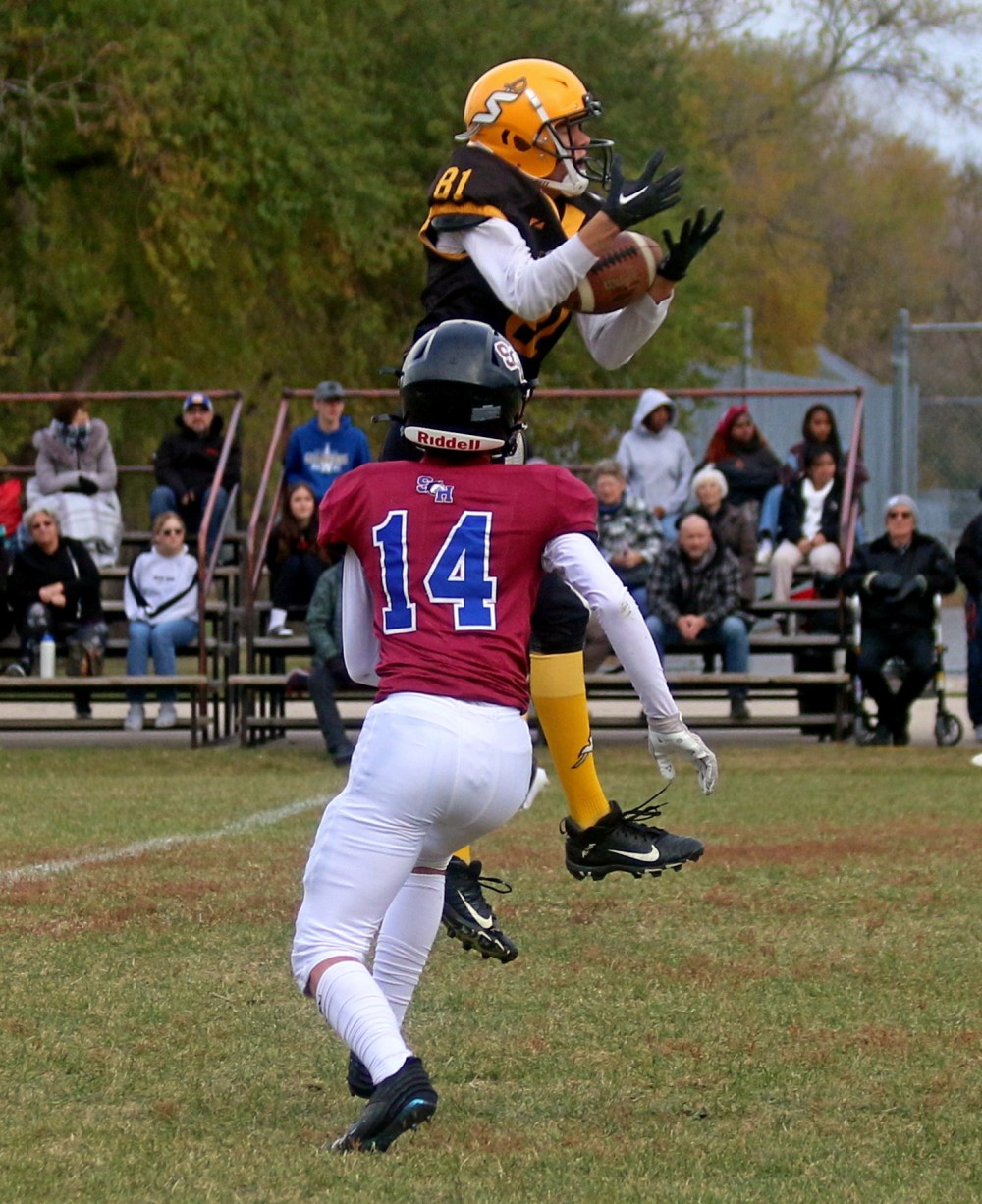 Marcus Johnson leaps in the air to make a catch during Steinbach Regional's big win against Sturgeon Heights. (Cassidy Dankochik The Carillon)