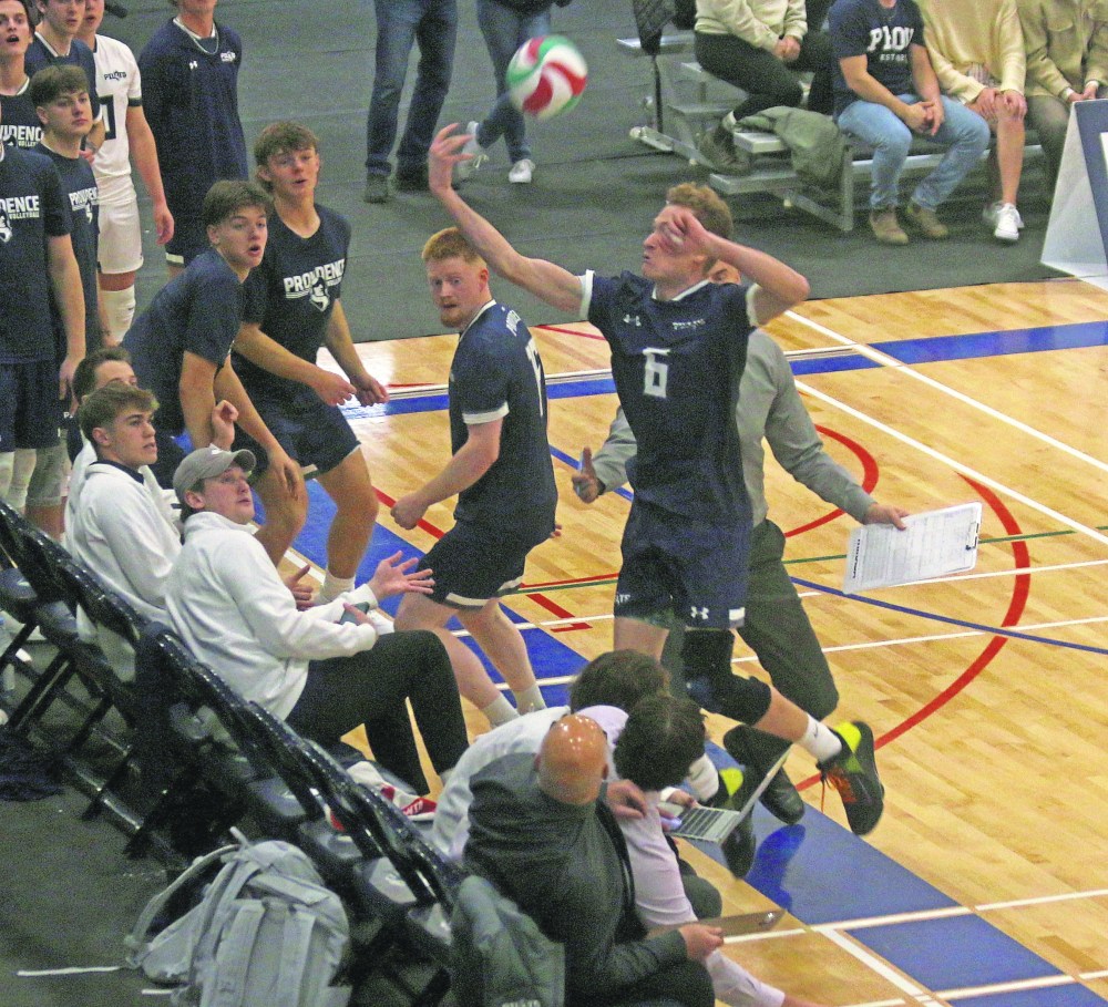 Freshman outside hitter Cayden Williams made a spectacular play in the first set against Assiniboine, saving a ball by crashing into his own bench, then turning around and picking up a kill. He was named Providence's player of the match. (Cassidy Dankochik The Carillon)