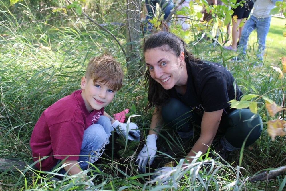 GREG VANDERMEULEN THE CARILLON
Adrielle Jodoin and her son Victor were among the volunteers planting trees during TD Tree Days.