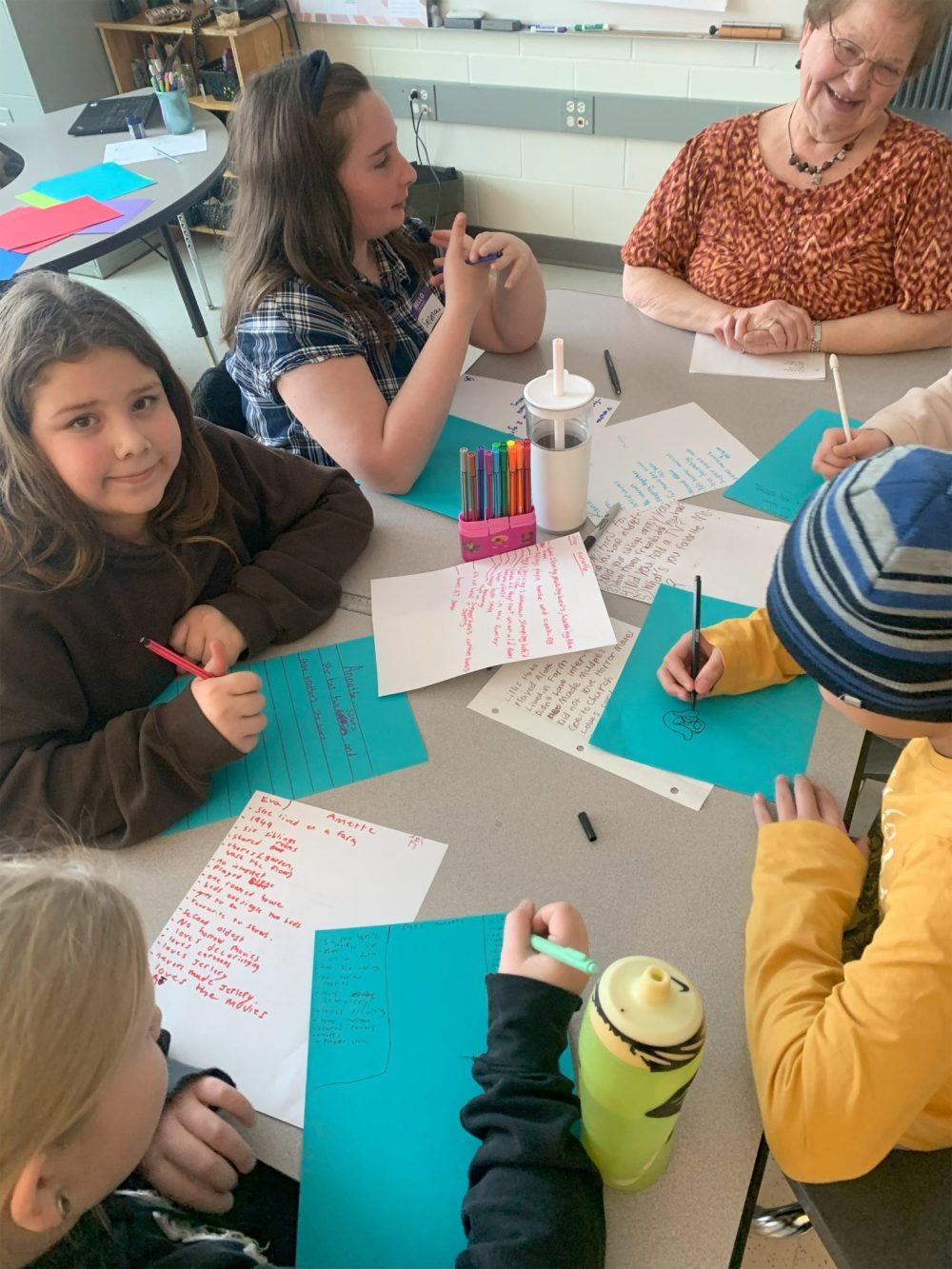 Submitted
Grand Pal Mrs. Annette with some Grade 5/6 students work on a project together.