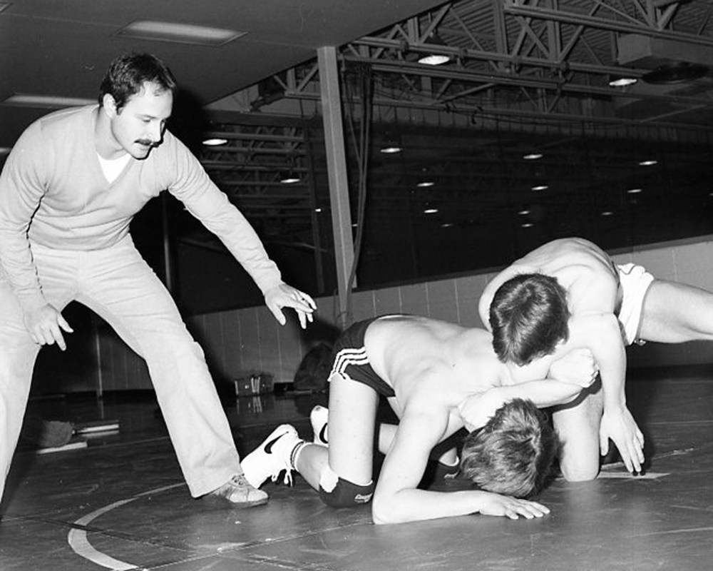 Steinbach wrestling coach Frank Paulicelli looks on as wrestlers work out at the Steinbach Collegiate gym in preparation for the junior meet at River East Collegiate. The five-member club was formed in October and had a good showing in their first meet early in January.