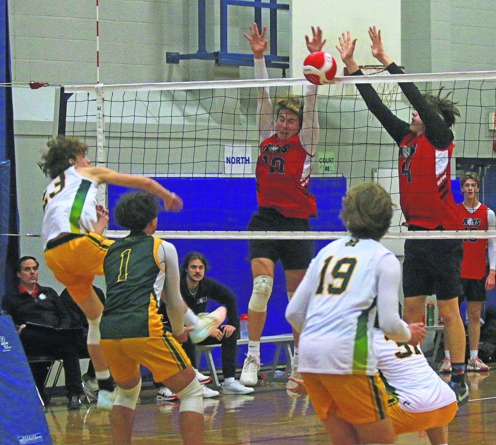 Ecole Gabrielle-Roy players Martin de Moissac and Kielo LaRochelle go up to block a Miles Macdonell kill attempt during the AAAA Manitoba High School Athletic Association provincial championship game hosted at Mennonite Brethren Collegiate Institute. Les Roys would go onto to beat the Buckeyes and upset the fourth ranked Glenlawn Lions to earn a semi-final spot at the tournament. (Cassidy Dankochik The Carillon)