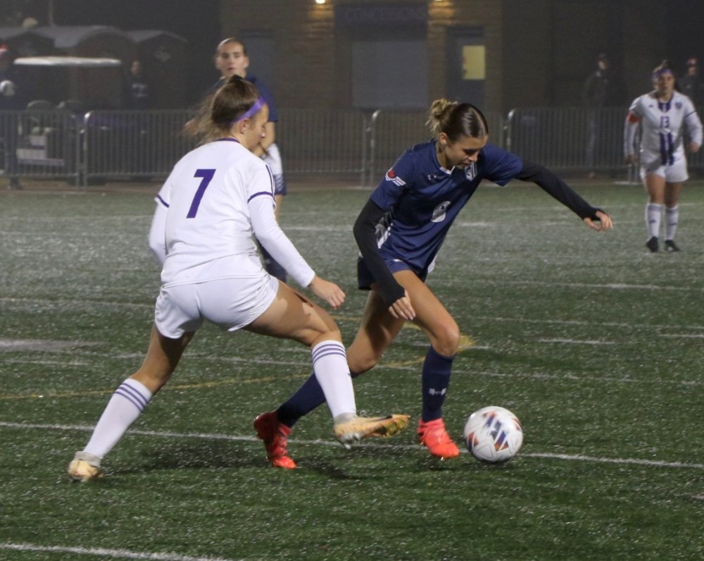 Hayley Medeiros looks to move the ball up the pitch against the host Crown College Polars during the NCCAA North Region division two qualifier. (Julia Herperger Providence College)