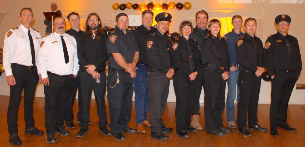 CHRIS GAREAU THE CARILLON
Reynolds Fire Department members and their trainer Troy Walker (third from left) at the Reynolds Fireman’s Ball Nov. 2 in Prawda.