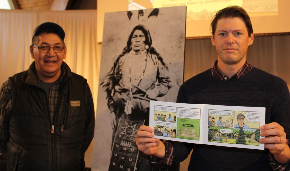 GREG VANDERMEUILEN THE CARILLON
Dave Scott and Jonathan Dyck stand in front of a photo of Scott’s ancestor, Ojibwa leader Big Goose with their new book, The Secret Treaty.