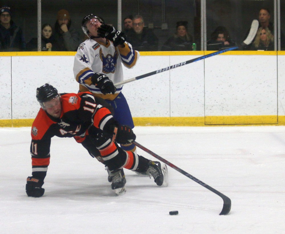 Ste Anne's Cody Fowlie and Springfield's Dane Hirst were both whistled for penalties on this play, as Fowlie's stick brushed Hirst's face as he was tripped. (Cassidy Dankochik The Carillon)