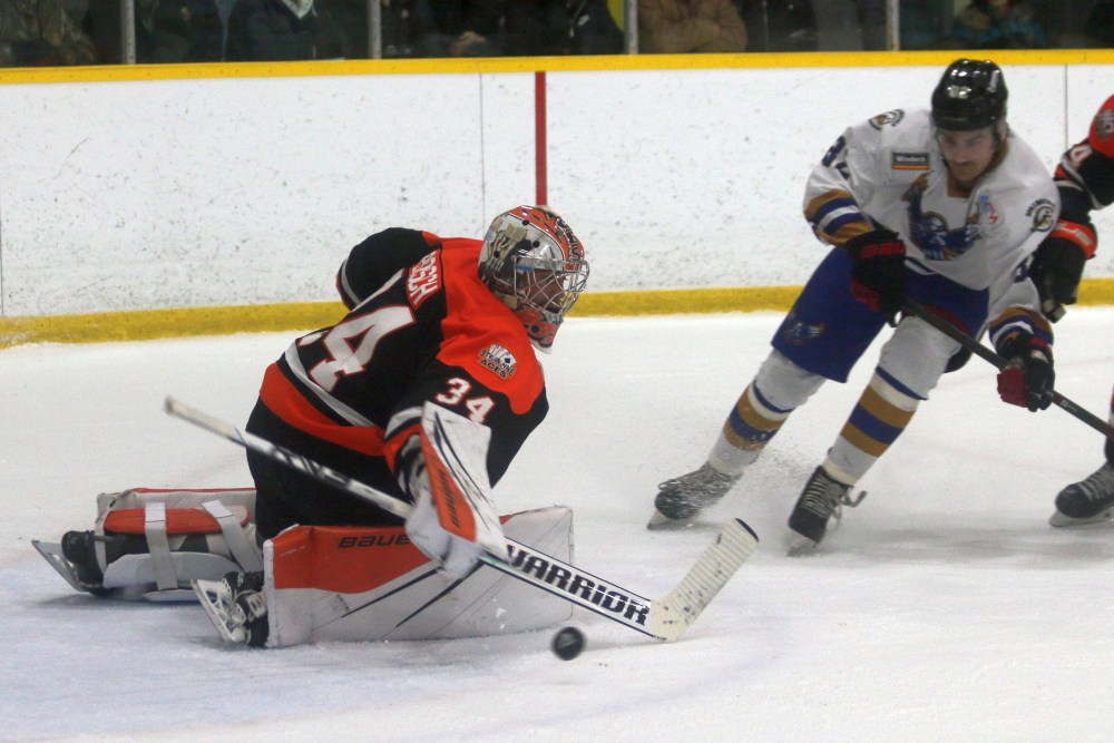 Travis Bosch ushers a puck away during the Springfield Winterhawks/Ste Anne Aces game Dec. 14. (Cassidy Dankochik The Carillon)