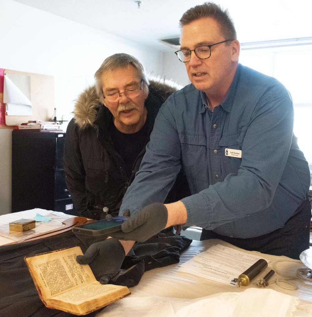 SVJETLANA MLINAREVIC THE CARILLON
Robert Peters (left) looks at Mennonite Heritage Village assistant curator Garth Doerksen's phone as he shows how a translation is done through an app from German to English from a notebook