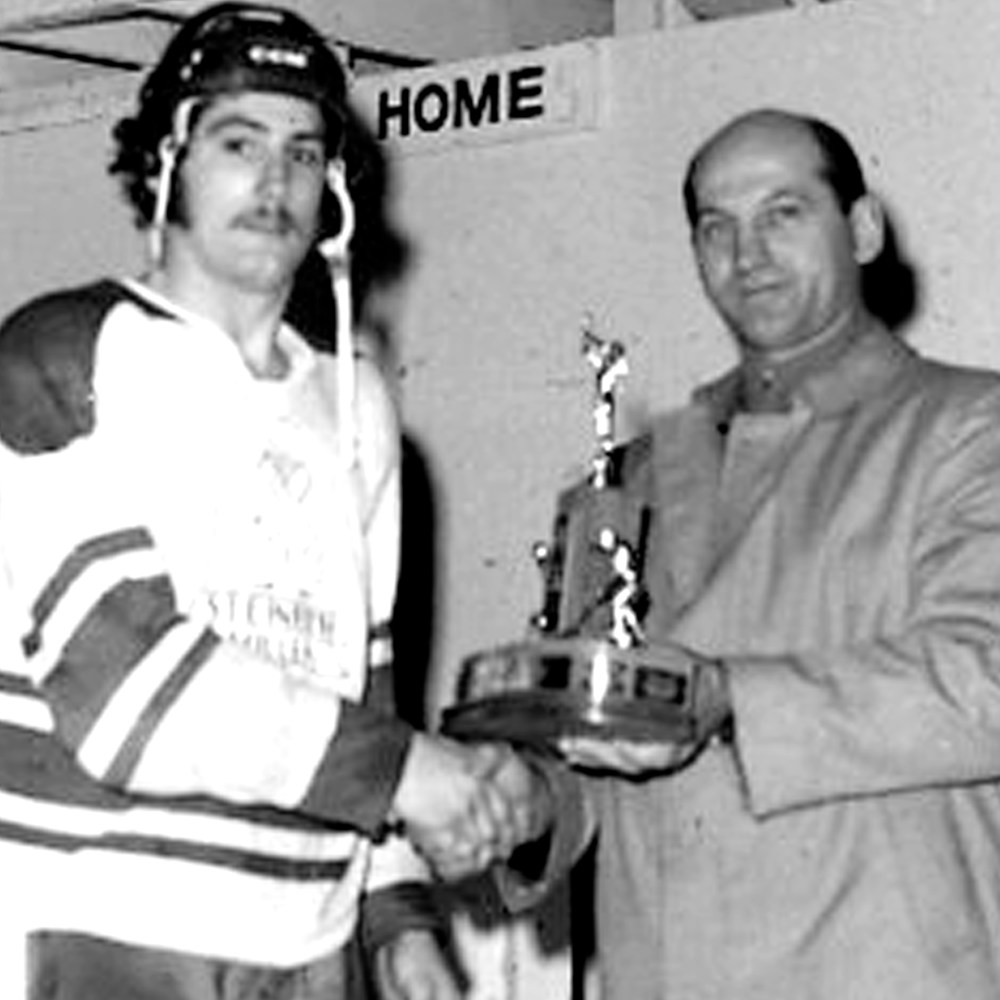 Steinbach Millers captain Ralph Krentz accepts the Baldy Northcott Trophy as Manitoba Junior “B” Hockey champions after his team skated to a three-game sweep in the provincial tournament in Steinbach. (Carillon Archives)