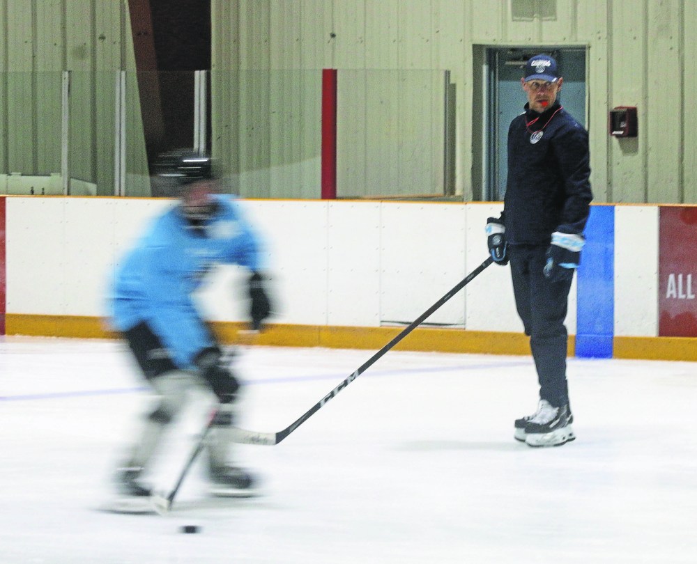 Steinbach Pistons head coach Paul Dyck watches prospective players during a drill Aug. 28 inside the T.G. Smith Centre. (Cassidy Dankochik The Carillon)