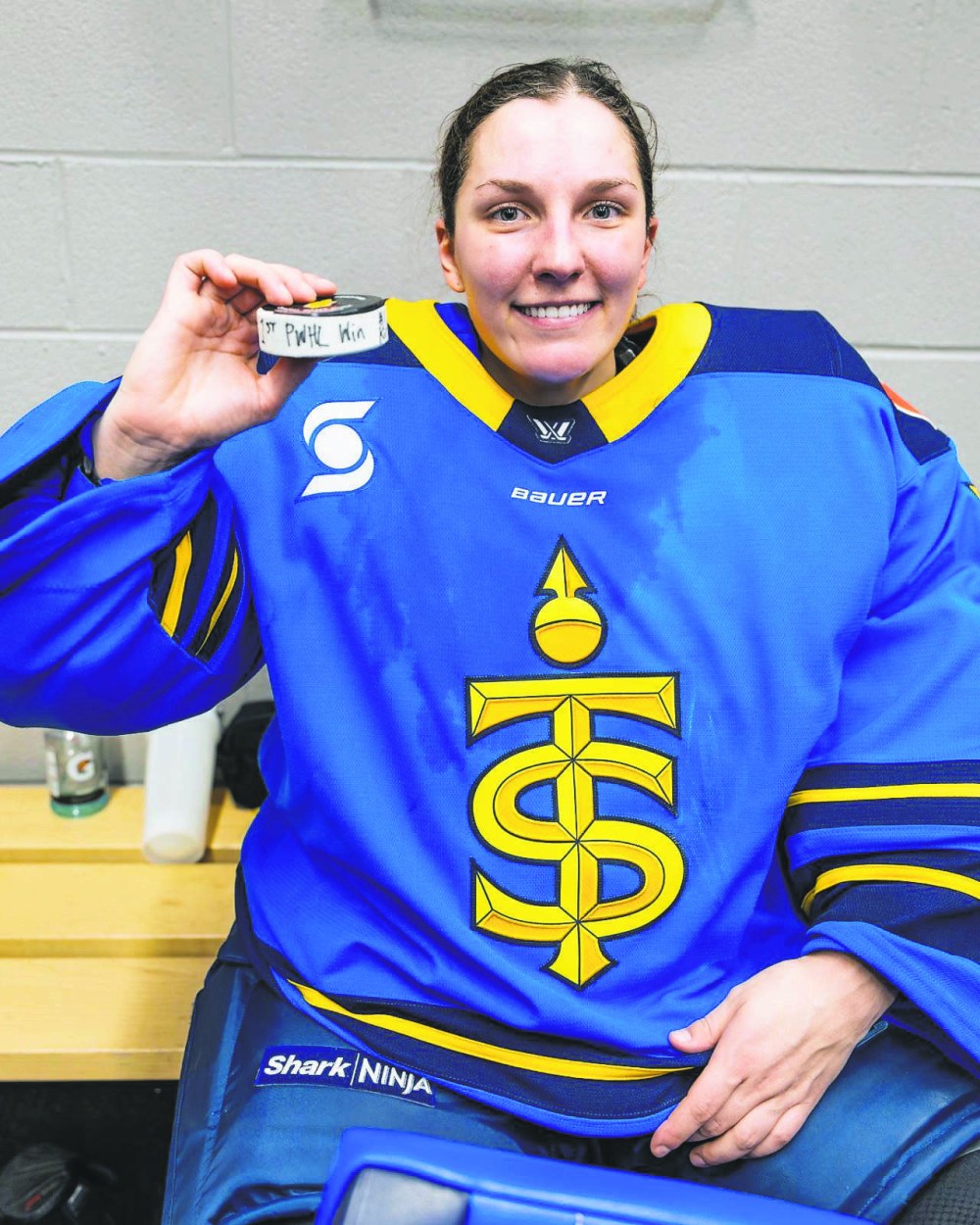 Ste Anne's Raygan Kirk holds her first Professional Women's Hockey League win puck after helping the Toronto Sceptres to a win against the Boston Fleet December 27th. (Toronto Sceptres Twitter)