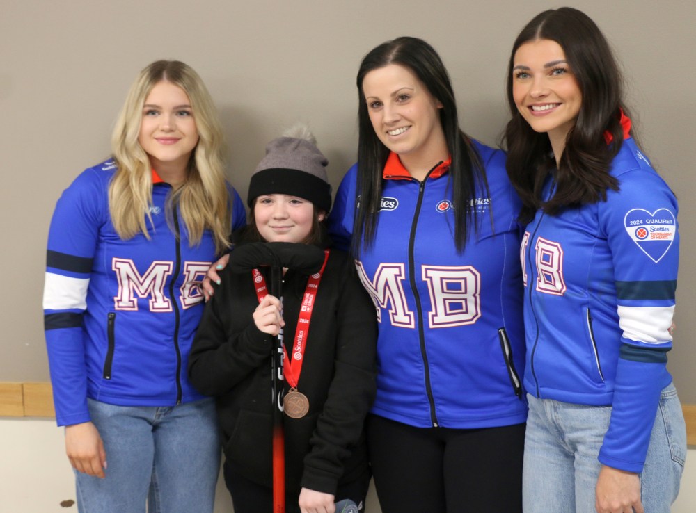 Team Kate Cameron poses with Kleefeld's Avery Heckert during New Bothwell's celebration of Cameron's bronze medal performance at the Scotties this year. (Cassidy Dankochik The Carillon)