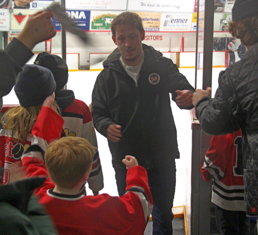 La Broquerie head coach Dan Taillefer gets a heroes welcome after the Habs upset league leaders St Malo to cap off a memorable Hockey Day in La Broquerie. (Cassidy Dankochik The Carillon)