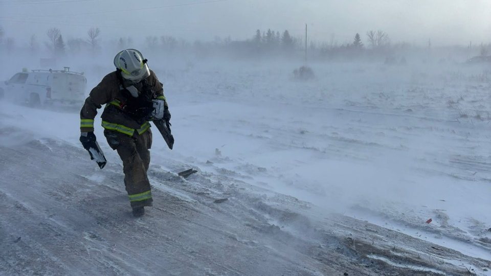 submitted
A La Broquerie firefighter in the punishing wind on Highway 52 on the east edge of Steinbach where a pile-up forced its closure for four hours Jan. 17.