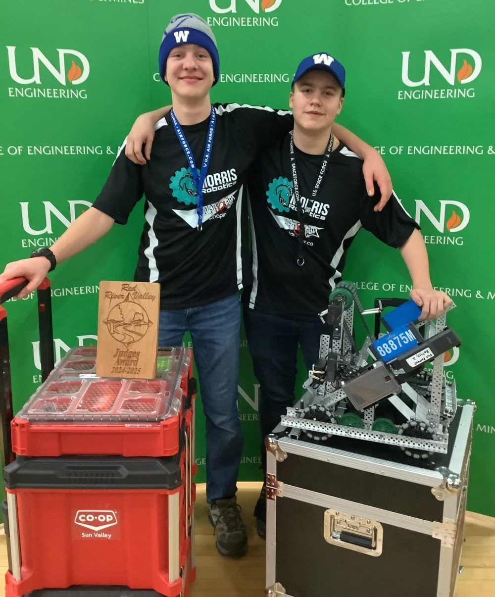 JP JAMIESON
Blue Bombur team members Cody Dueck (left) and Kayden Grattan (right) celebrate getting the Judge’s Award for sportsman-like conduct at the Red River Valley VEX V5 Robotics Competition in Minnesota on Jan. 25. This tournament saw the team advance to the world championships.