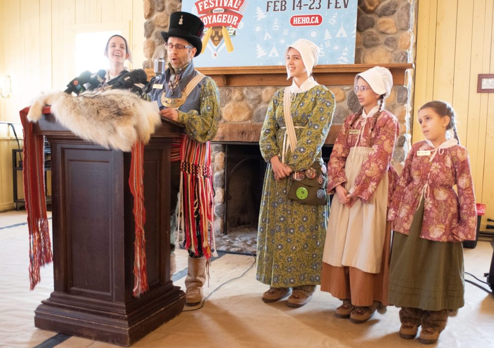 SVJETLANA MLINAREVIC THE CARILLON
Philippe Hutlet speks to reporters during the opening ceremony for the Festival Du Voyageur. Hutlet and his family are the Official Voyageurs for the 10 day event. In the photo is his wife Daniele (left) and his daughters Danika, Elise, and Mia. Missing is his son Remi.
