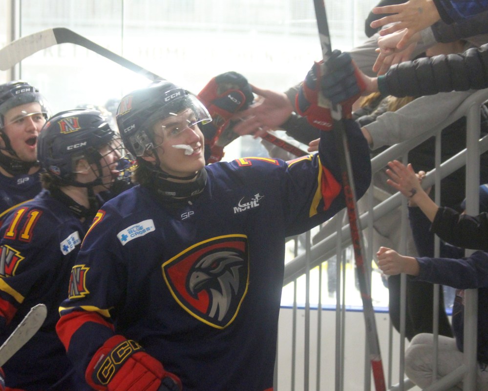 Matteo Speranza is welcomed off the ice by dozens of young Niverville Nighthawks fans following their 4-0 victory over Dauphin. Feb. 8. (Cassidy Dankochik The Carillon)