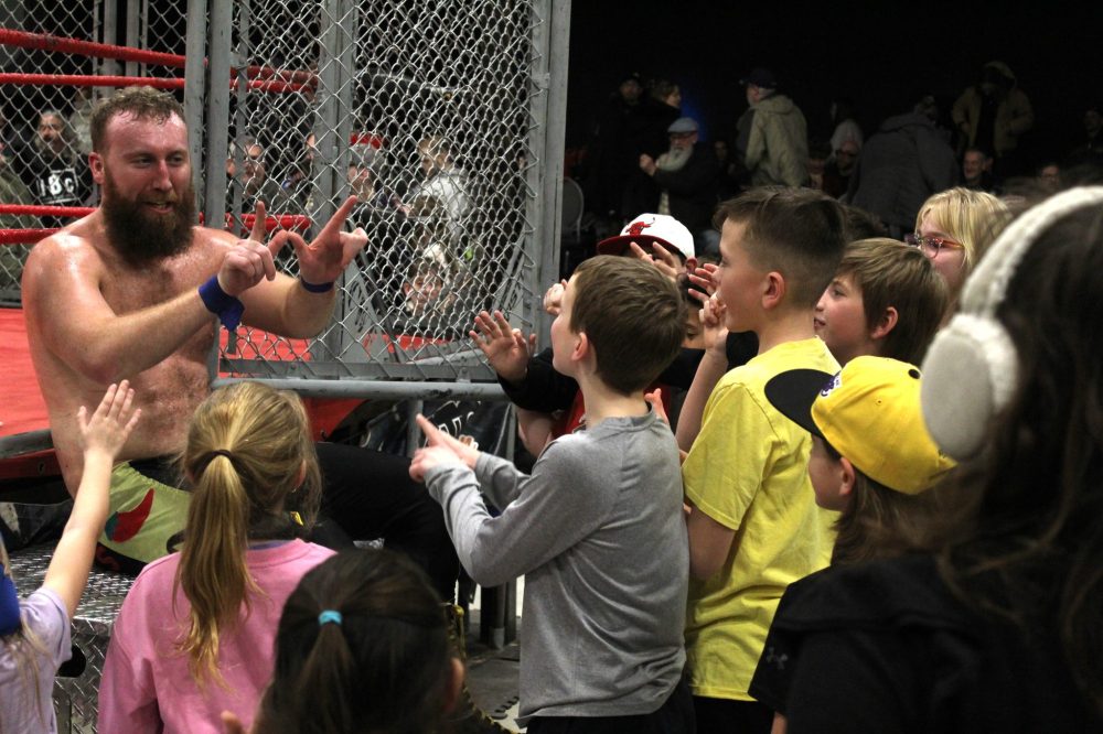 CHRIS GAREAU THE CARILLON
Red Hot Sammy Peppers celebrates his cage match win with his fans in Steinbach Feb. 1. The CWE returns to the Southeast in St Adolphe on Mar. 15.