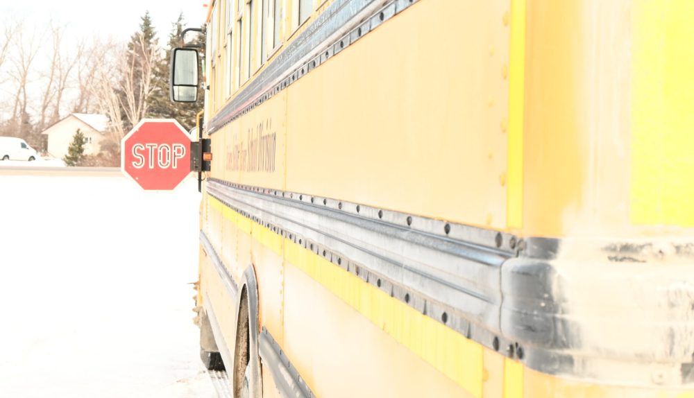 ALEX LAMBERT THE CARILLON
An SRSD school bus extends its stop sign to halt drivers so it can safely drop children off. Transport Canada is mandating cameras around buses for all new school buses by late 2027.