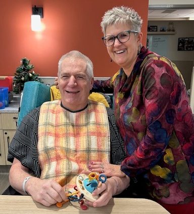 SUPPLIED
Herb and Linda Wiebe pose for a photo at Rest Haven Care Home as Herb holds the new toy that helps keep his hands busy.