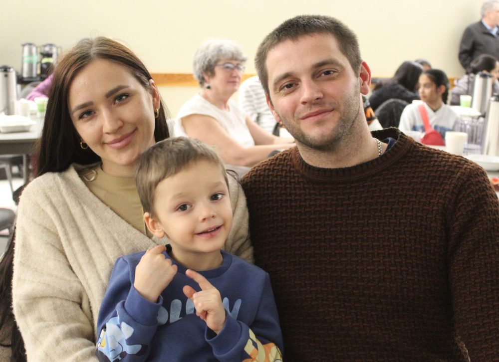 CHRIS GAREAU THE CARILLON
Steinbach’s Laichuk family Lindmyla, Mark, 3, and Oleksii take in the Nigeria night of Culturama. They enjoyed being entertained while learning about a newer culture that makes its home in the city. The Laichuk’s themselves moved here two years ago from Ukraine.