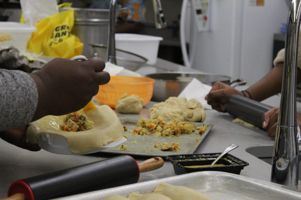 CHRIS GAREAU THE CARILLON
Local caterer Onyeyiri Chinwe Juliet’s African Best Bite provided the 300 dishes of chicken or mushroom pies each hand folded, and sweet puff puffs for Nigeria night at Culturama.