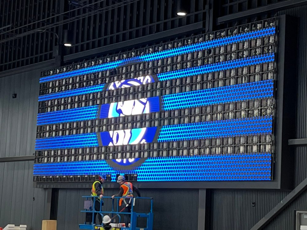 Workers at the Southeast Event Centre put the finishing touches on one of two huge video boards that will be key points of Steinbach Pistons game production when the team moves into the new building. (Steinbach Pistons Twitter)