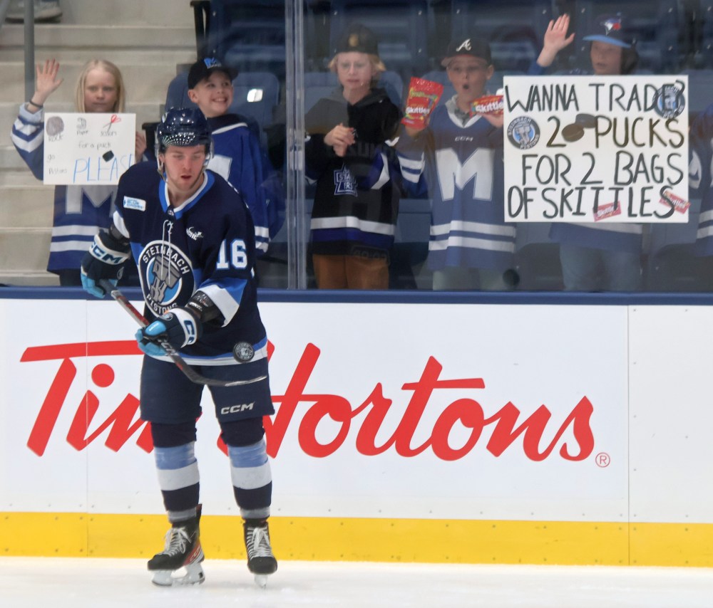 Connor Paronuzzi dazzles gathered kids during warm-ups of Steinbach's game against Selkirk March 14. It was the first game at the new Steinbach Event Centre. (Cassidy Dankochik The Carillon)