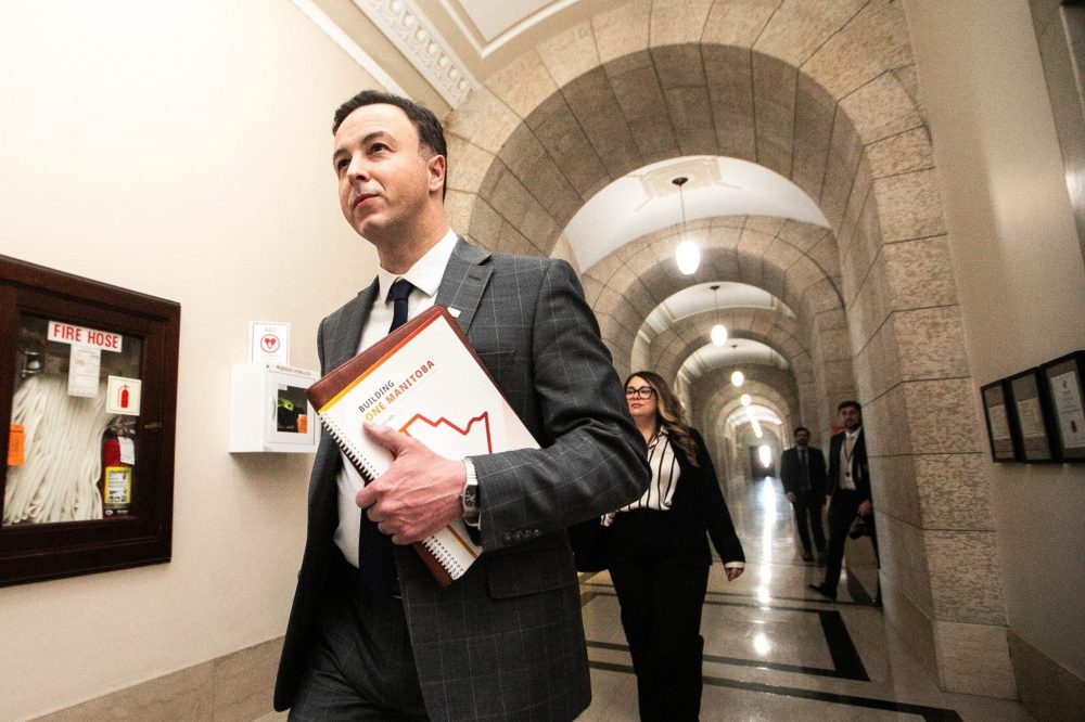 MIKAELA MACKENZIE WINNIPEG FREE PRESS ARCHIVES
Finance minister Adrien Sala walks into the media lockup with the budget at the Manitoba Legislative Building on March 20.