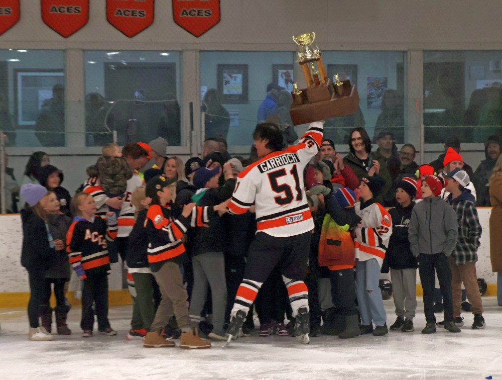 When Harley Garrioch got his turn with the SEMHL championship trophy, he was sure to take it to the gathering of kids who joined the Ste Anne Aces on the ice following their game seven victory over Springfield. (Cassidy Dankochik The Carillon)
