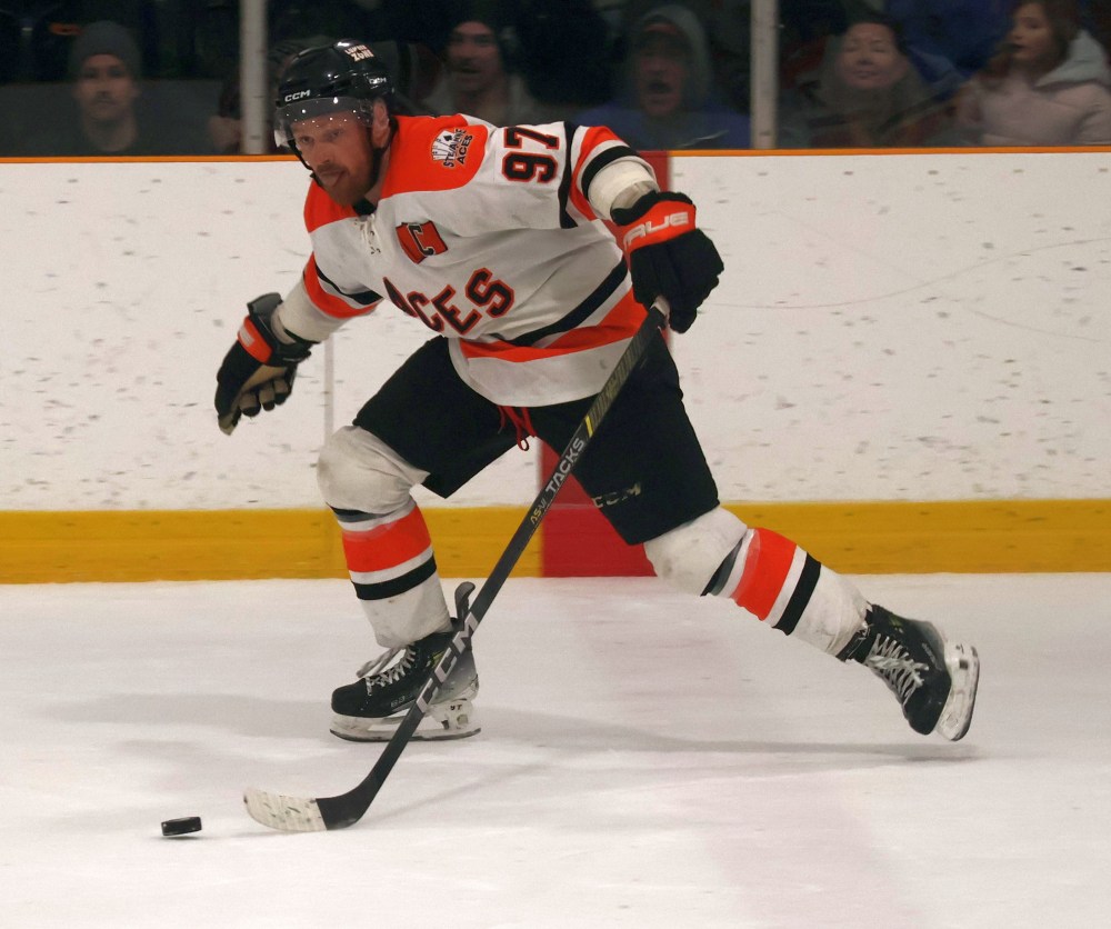 Brenden Walker carries the puck up the ice during game seven of the SEMHL finals. (Cassidy Dankochik The Carillon)