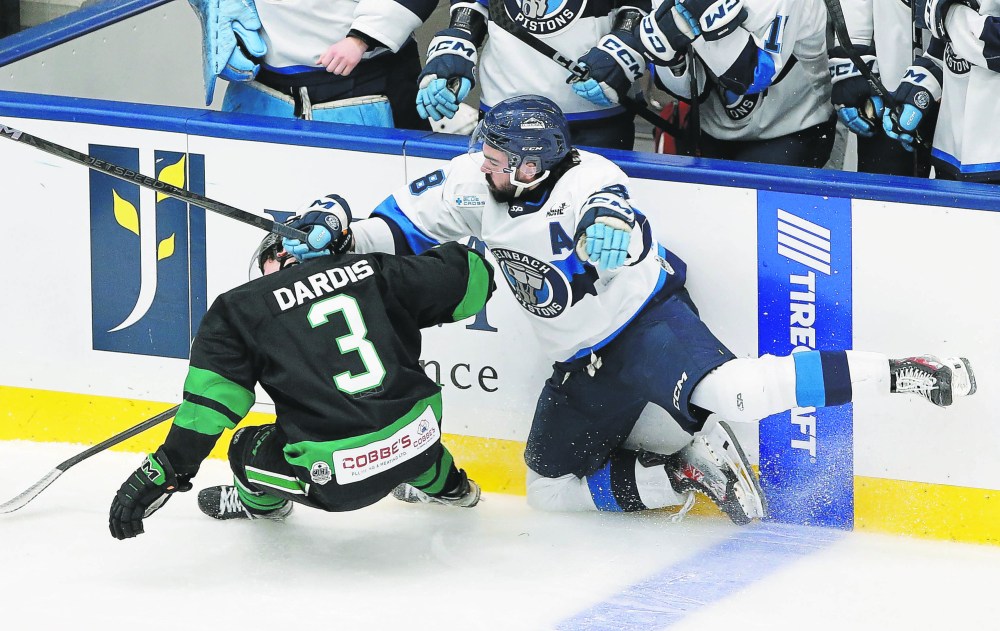JOHN WOODS / WINNIPEG FREE PRESS
Steinbach PistonsՠBrayden Barnett (18) and Portage TerriersՠGrant Dardis (3) collide in first period playoff action in Steinbach Monday, March 25, 2025.
