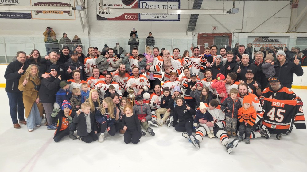 The Aces invited fans onto the ice to take part in a championship photo following their game seven victory. (Cassidy Dankochik The Carillon)