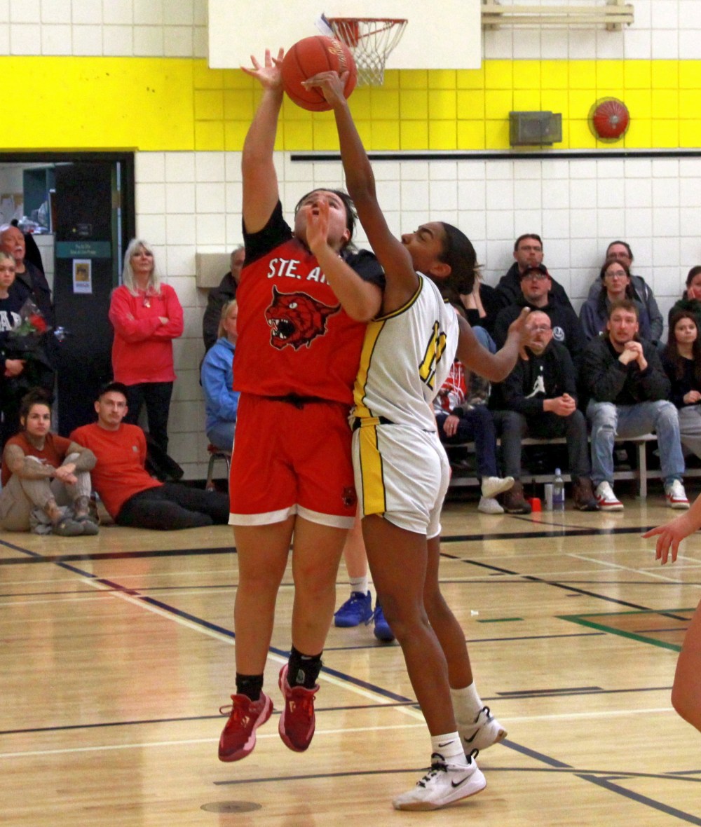 Kiana McDonald blocks a Ste Anne shot during the varsity girls Zone 13 basketball championships Feb. 26. (Cassidy Dankochik The Carillon)