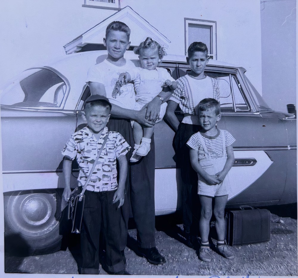SUPPLIED
In this photo from the 1950s, Philippe Sabourin (left) poses with siblings on their mixed farm near St Jean.