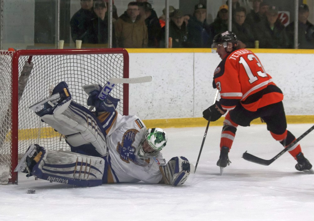 Steve Christie unleashes a two-pad stack save during game two of the SEMHL finals. (Cassidy Dankochik The Carillon)