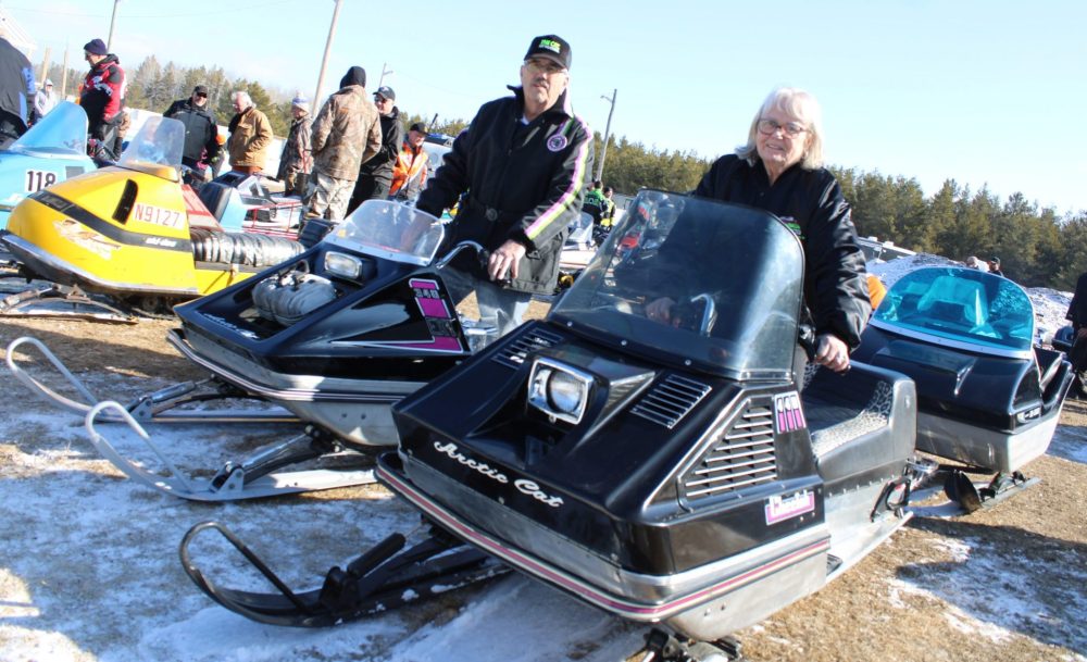 GREG VANDERMEULEN THE CARILLON 

Dave and Ivy Boutang astride their Arctic Cats. Dave’s is a 1971 340 EXT while Ivy is on a 440 Cheetah. Hooked behind Ivy’s sled is a 1970 cutter built in Winnipeg by Equinox who supplied them to the Arctic Cat factory in Thief River Falls.