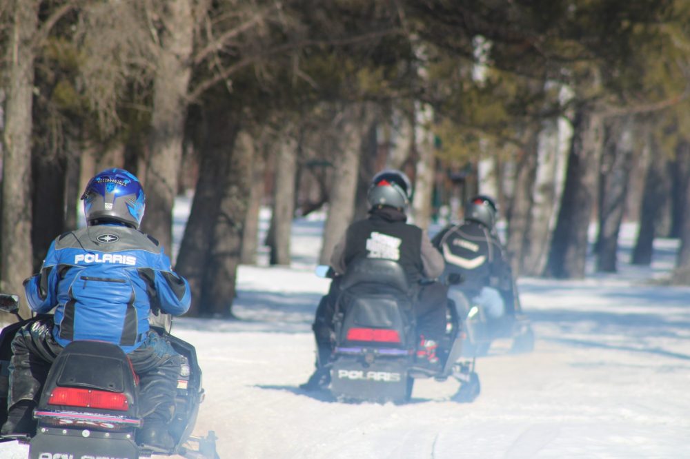 GREG VANDERMEULEN THE CARILLON
Snowmobiles leave on their ride.