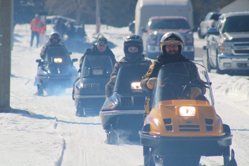 GREG VANDERMEULEN THE CARILLON
Snowmobiiles hit the trail through a haze of exhaust.
