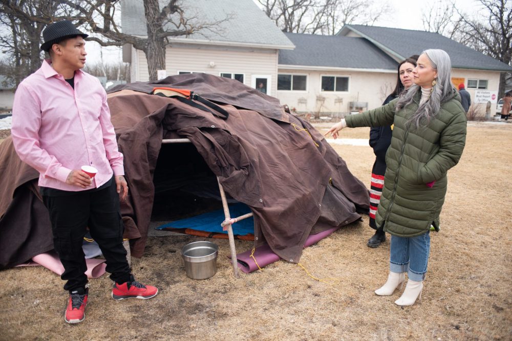 SVJETLANA MLINAREVIC THE CARILLON
Minister of Families Nahanni Fontaine visited the El'dad Ranch in Steinbach on Tuesday April 1, 2025, to see firsthand the work that the agency is doing. Here El'dad resident Michael Meeko McDonald shows her the sweat lodge that is on the property. El'dad helps residents with intellectual disabilities who are part of the alternative justice program and those who are in the day program learn life skills and get employment.