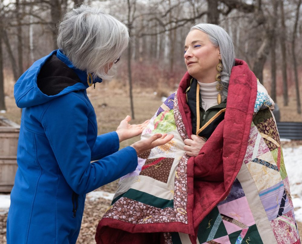 SVJETLANA MLINAREVIC THE CARILLON
Minister of Families Nahanni Fontaine visited the El'dad Ranch in Steinbach on Tuesday April 1, 2025, to see firsthand the work that the agency is doing. Here MCC Manitoba board chair Janet Plenert finished wrapping a ceremonial blanket around Fontaine's shoulders. El'dad helps residents with intellectual disabilities who are part of the alternative justice program and those who are in the day program learn life skills and get employment.
