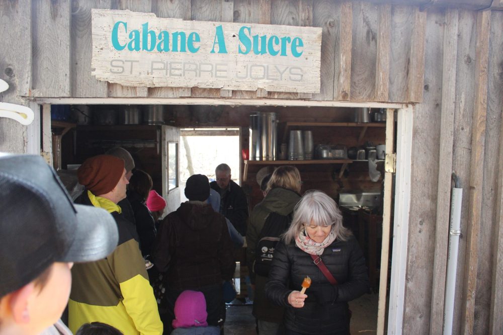 CHRIS GAREAU THE CARILLON
The Cabane a Sucre was the place to get maple taffy during the Sugaring Off Festival in St Pierre.