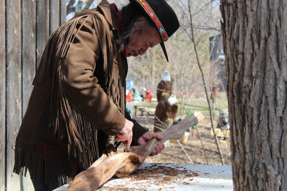CHRIS GAREAU THE CARILLON
Fern Hebert carves a diamond willow branch for a walking stock during the Sugaring Off Festival in St Pierre.