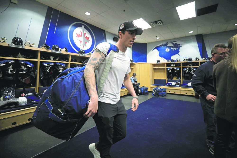 Ruth Bonneville / Free Press
Sports Jets Dressing Room scrum
Haydn Fleury makes his way out of the Jets locker room as the players pack up to leave for the season Tuesday.
