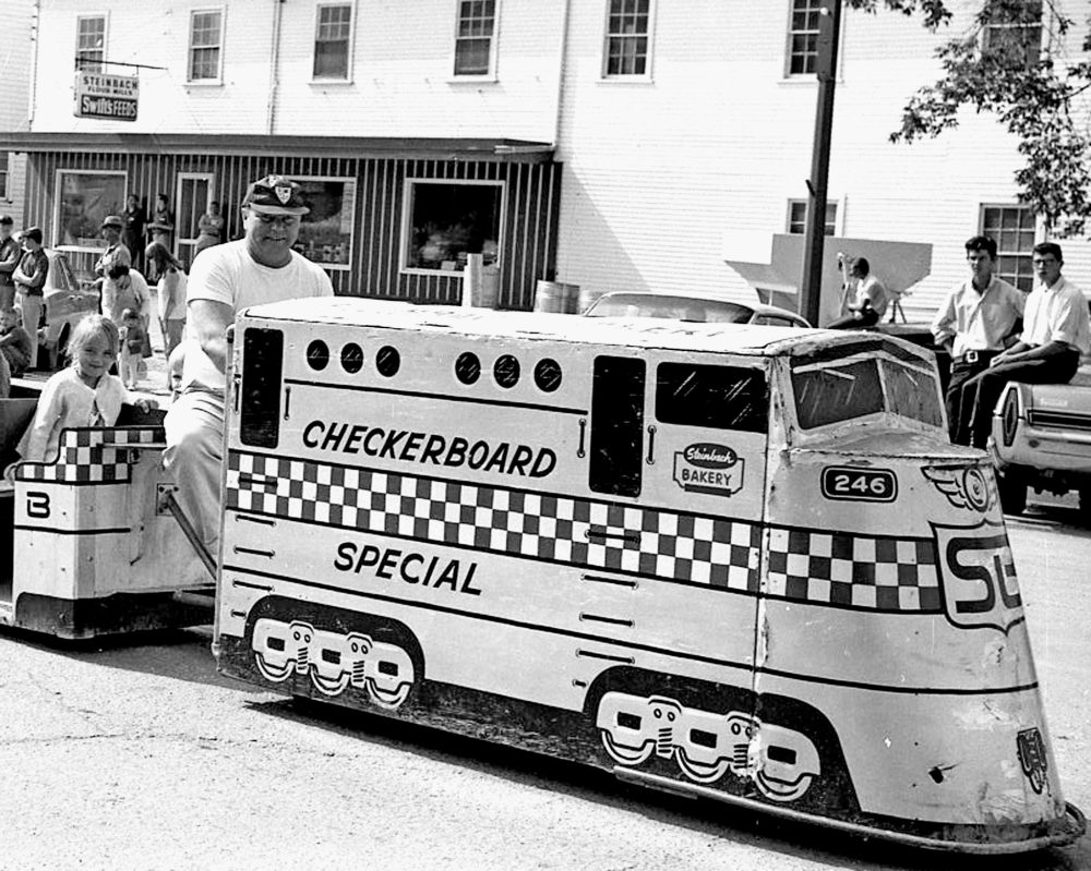 CARILLON ARCHIVES
The Checkerboard Special, with Chuck Toews at the controls, gives Steinbach residents a look at its first train on Main Street during a 1968 parade and three years later Mayor A.D. Penner brought the idea back to the council table.